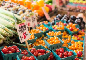 Rows and baskets of fresh fruits and vegetables